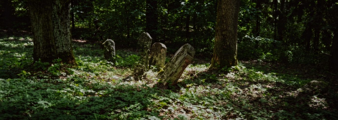 Unmarked tombstone in a rural setting